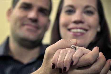 Picture 183 Brian McGuinn shows off his wife's engagement ring after finding it once he sifted through 9 tons of garbage. Photo courtesy of the Sun Sentinel.