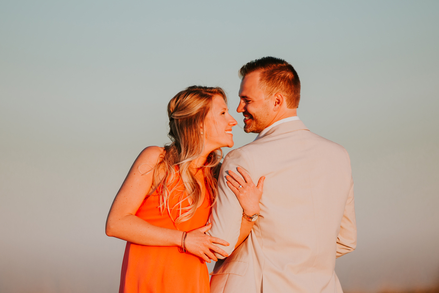 beach proposal happy couple