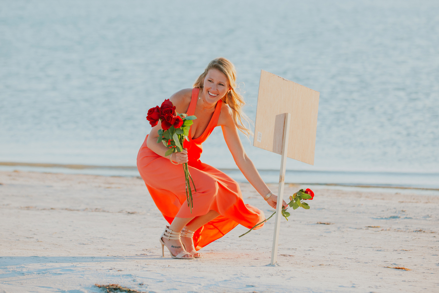 beach proposal sign