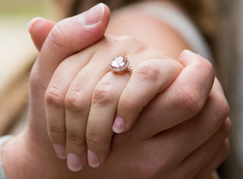 happy couple proposal engagement ring dogs beach