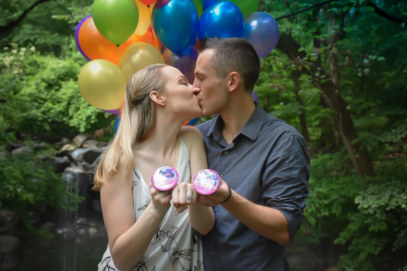 michael and cassidi proposal balloons kiss